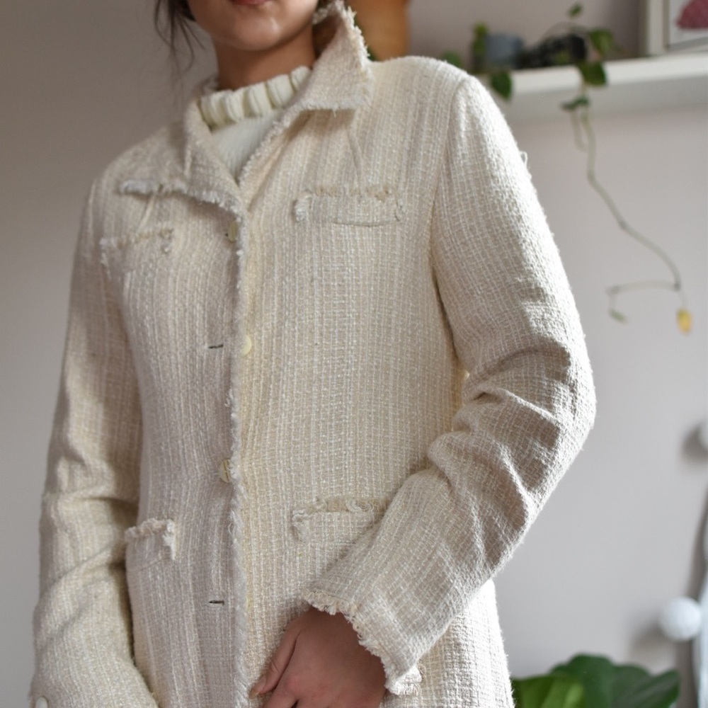 Ivory white tweed duster coat with ruffle trim